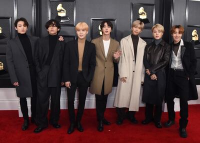 FILE - BTS arrives at the 62nd annual Grammy Awards in Los Angeles on Jan. 26, 2020. The popular band will perfrom at this month's Grammy Awards. (Photo by Jordan Strauss/Invision/AP, File)
