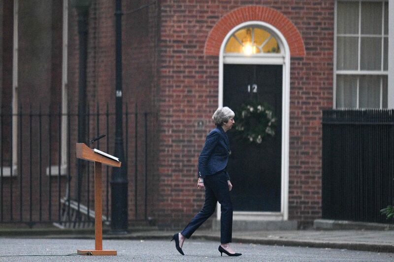 Theresa May leaves the lecturn after making a statement. AFP
