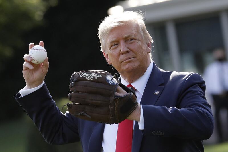US President Donald Trump throws a baseball on the South Lawn of the White House in Washington to celebrate opening day of the Major League Baseball season. Bloomberg