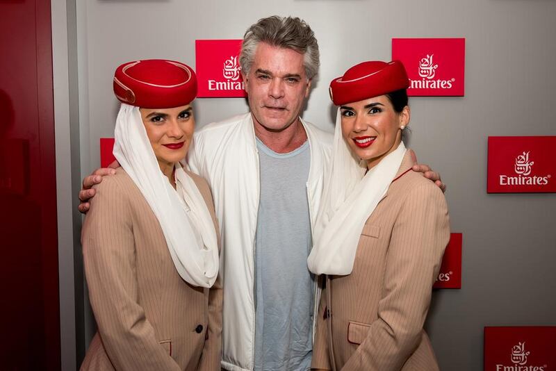  Liotta with Emirates flight attendants. Photo: Emirates