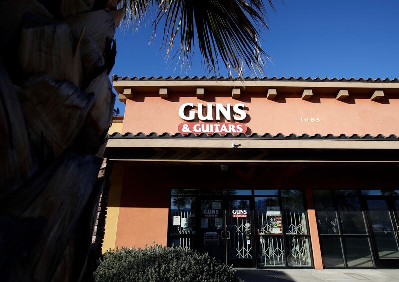 The Guns & Guitars store in Mesquite, Nevada. The store's general manager Christopher Sullivan said in a statement that Stephen Paddock showed no signs of being unfit to buy guns. Paddock killed dozens and injured hundreds Sunday night when he opened fired at an outdoor country music festival in Las Vegas. Chris Carlson / AP Photo