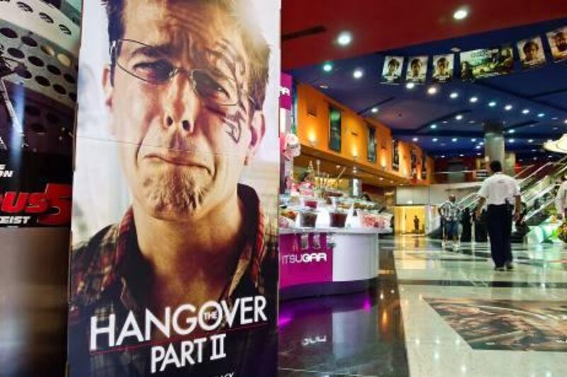 May 26,  Mall visitors pass the cinema poster of The Hangover Part II at the Cinemas in Mall Of The Emirates, May 26, 2011 Dubai, United Arab Emirates (Photo: Antonie Robertson/The National)