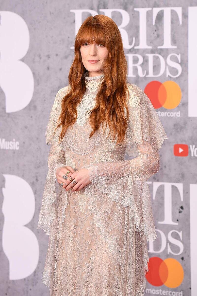 Florence Welch in high-neck lace Gucci. Photo: Getty