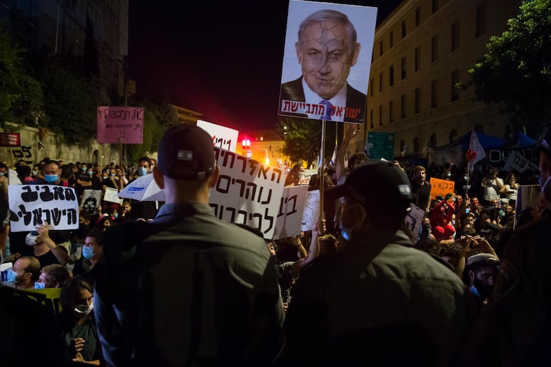 Israeli Prime Minister Benjamin Netanyahu is also facing criticism for staying in office whilst facing corruption charges. Getty