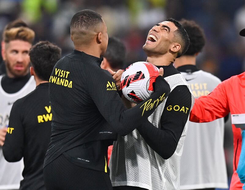 PSG's Kylian Mbappe and Achraf Hakimi during training at the Khalifa International Stadium in Doha. EPA