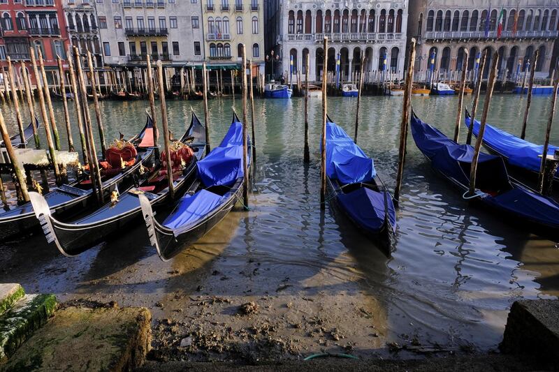 Gondolas are seen in the Grand Canal during low tide. Reuters