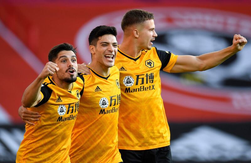 Wolverhampton Wanderers' Raul Jimenez (centre) celebrates with team-mates Pedro Neto (left) and Leander Dendoncker after scoring his side's first goal of the game during the Premier League match at Bramall Lane, Sheffield. PA Photo. Picture date: Monday September 14, 2020. See PA story SOCCER Sheff Utd. Photo credit should read: Peter Powell/NMC Pool/PA Wire. EDITORIAL USE ONLY No use with unauthorised audio, video, data, fixture lists, club/league logos or "live" services. Online in-match use limited to 120 images, no video emulation. No use in betting, games or single club/league/player publications.