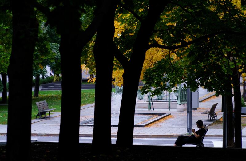A woman at a park in the Montreal financial district on 28 September 28. Paul Chiasson/The Canadian Press via AP