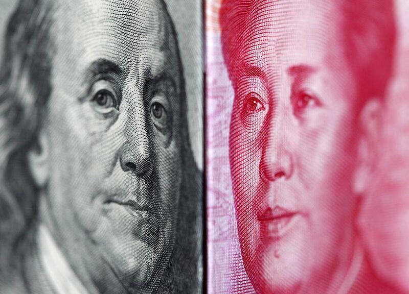 Benjamin Franklin and Mao Zedong are long dead, but as standard-bearers on their nations’ banknotes, their value is always fluctuating. Nicky Loh / Reuters