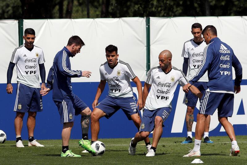 Argentina's players, from left, Ever Banega, Lionel Messi, Marcos Acuna, Javier Mascherano, and Angel di Maria attend a training session. Alberto Estevez / EPA