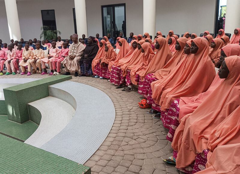 Nigerian students and staff who were kidnapped this month sit at the local government house after being freed, in Kaduna, Nigeria. Reuters