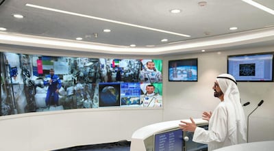 Sheikh Mohamed Bin Rashid talks with Emirati astronaut, Hazza Al Mansouri, during a live satellite feed from the International Space Station. Courtesy Dubai Media Office