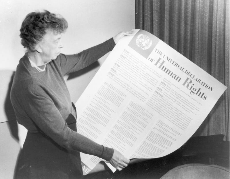 Eleanor Roosevelt holds up a copy of 'THE UNIVERSAL DECLARATION OF HUMAN RIGHTS', circa 1947. (Photo by Fotosearch/Getty Images).