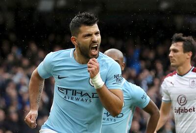 Manchester City's Sergio Aguero celebrates scoring his side's first goal from the penalty spot, equaling Manchester City's all-time scoring record, during the English Premier League soccer match between Manchester City and Burnley, at the Etihad Stadium, in Manchester, England, Saturday, Oct. 21, 2017. (Martin Rickett/PA via AP)