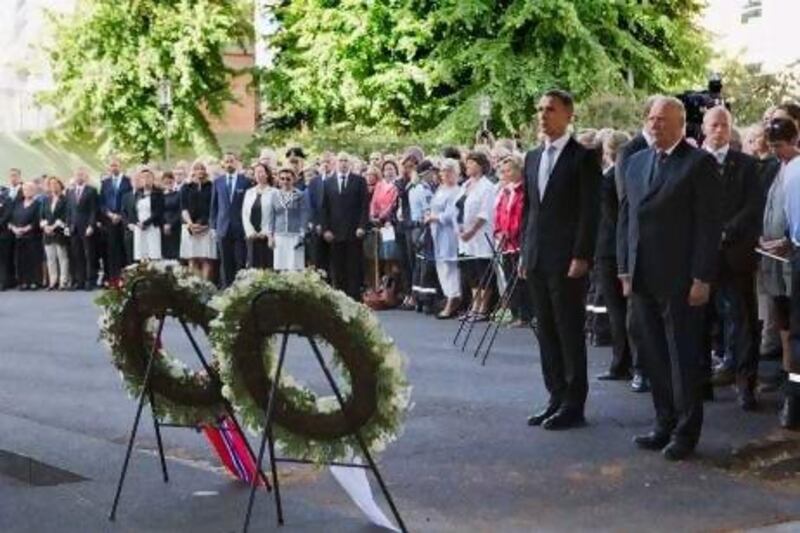 Norway’s King Harald, right, and prime minister Jens Stoltenberg stand together during a wreath-laying ceremony to mark the first anniversary of the bomb and shooting tragedy in Oslo and Utoeya Island.