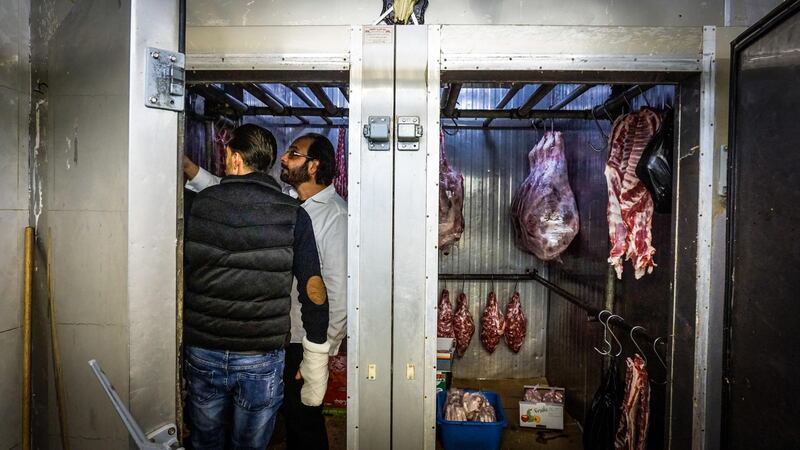 Chef Fadi Kattan choose his cuts of meat. Photo by Jack Moore