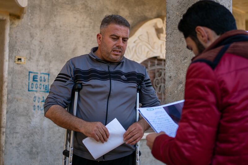 Also benefiting from the NGO's services is Ibrahim Al Sheikh, 45, from the village of Bithynia, Iblib province. He too was injured in the earthquake. ‘The memory is extremely painful for me, because I suffered a severe injury to my feet and treatment continues now, a year on,’ he told The National