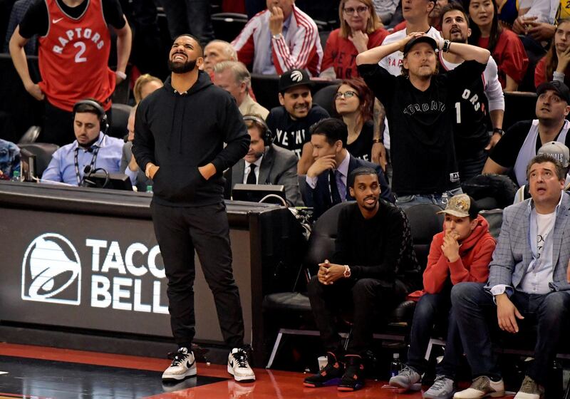 Drake cannot hide his emotions as the game slips away from the Raptors. Reuters