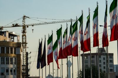 National flags of Iran line a section of the Hashemi Rafsanjani highway as a construction crane stands beyond in Tehran, Iran, on Saturday, Nov. 3, 2018. Iran’s Supreme Leader Ayatollah Khamenei said U.S. President Donald Trump’s policies are opposed by most governments and fresh sanctions on the Islamic Republic only serve to make it more productive and self-sufficient, the semi-official Iranian Students’ News Agency reported. Photographer: Ali Mohammadi/Bloomberg
