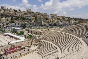 Roman amphitheatre in downtown with Amman cityscape at background. IMF says international donor support for Jordan crucial to preserve economic stability.