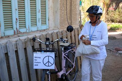 Dorothee and her pink e-bike, which she calls Miss Piggy. AP