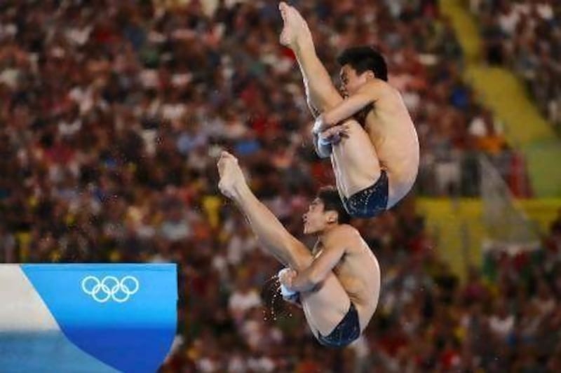China's Cao Yuan, left, and Zhang Yanquan won gold in the men's synchronised 10m platform final. Toby Melville / AFP