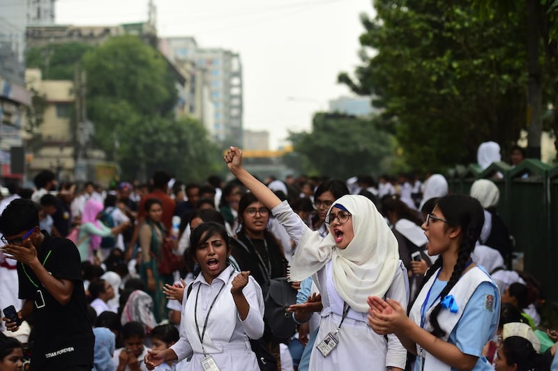 Bangladeshi students block a road during a student protest in Dhaka. AFP PHOTO / MUNIR UZ ZAMAN