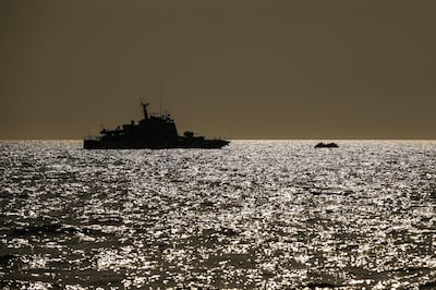 A Turkish coast guard vessel approaches a life raft with migrants in the Aegean Sea, between Turkey and Greece, Saturday, Sept. 12, 2020. Turkey is accusing Greece of large-scale pushbacks at sea â€” summary deportations without access to asylum procedures, in violation of international law. The Turkish coast guard says it rescued over 300 migrants "pushed back by Greek elements to Turkish waters" this month alone. Greece denies the allegations and accuses Ankara of weaponizing migrants.(AP Photo/Emrah Gurel)