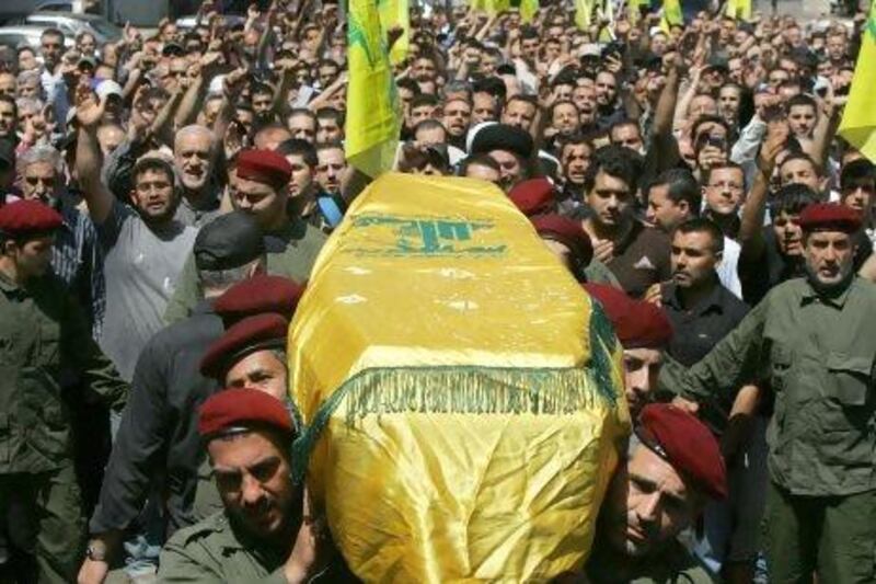 Lebanon's Hizbollah troops carry the coffin of their comrade Hussein Ahmed Abul Hassan during his funeral in southern Beirut. Elite Hizbollah fighters are pouring into Syria to lead a withering assault by President Bashar Al Assad.