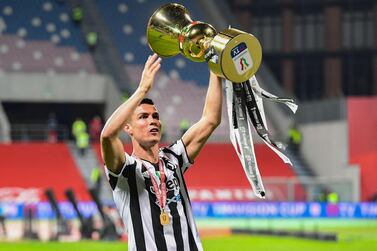 Juventus forward Cristiano Ronaldo holds the trophy after his side's Coppa Italia triumph. AFP
