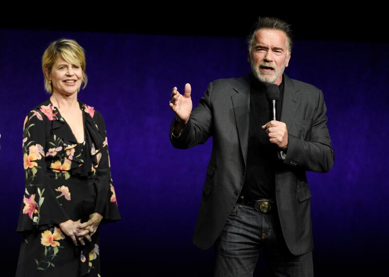 Arnold Schwarzenegger, right, a cast member in the upcoming film "Terminator: Dark Fate," talks about the film as fellow cast member Linda Hamilton looks on during the Paramount Pictures presentation at CinemaCon 2019, the official convention of the National Association of Theatre Owners (NATO) at Caesars Palace, Thursday, April 4, 2019, in Las Vegas. (Photo by Chris Pizzello/Invision/AP)