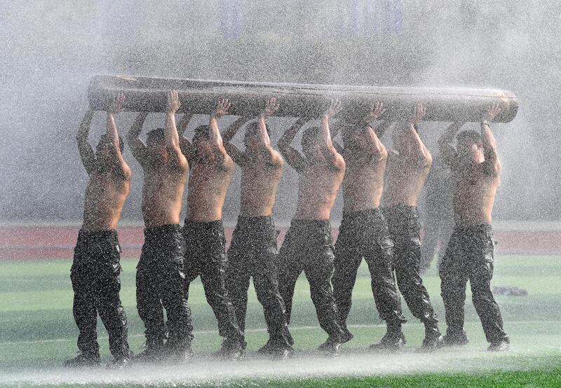 Police officers from China's Special Weapons and Tactics team take part in a training session in Chengdu, Sichuan province. Reuters