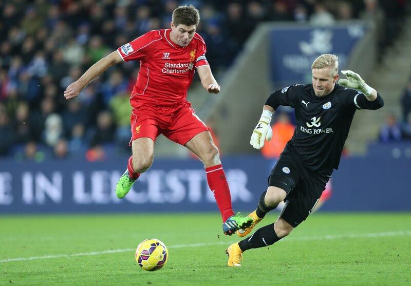 Liverpool's Steven Gerrard tries to round Leicester City keeper Kasper Schmeichel during Liverpool's 3-1 Premier League win on Tuesday at the King Power Stadium. Kieran Galvin / EPA / December 2, 2014 