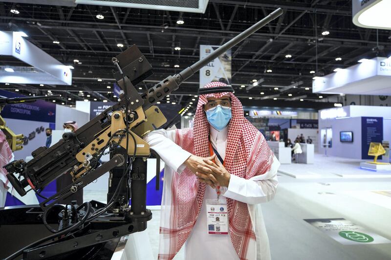 Abu Dhabi, United Arab Emirates, February 21, 2021.  Idex 2021, the first major in-person exhibition held in Abu Dhabi since the start of the Covid-19 pandemic, opened its doors to delegates on Sunday morning. --  Abdulelah Al Mohaimeed with the RFO or remote firing option 50. Cal heavy machine gun made by Wahaj of Saudi Arabia.
Victor Besa / The National
Section:  NA
Reporter:  John Dennehy
