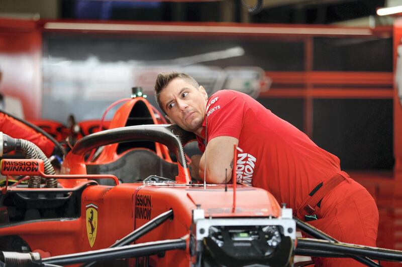 Abu Dhabi, United Arab Emirates, December 1, 2019.  
Formula 1 Etihad Airways Abu Dhabi Grand Prix.
--  VIP and drivers arrive at the Yas Marina Circuit.  A race engineer bussy tuning a Ferrari car.
Victor Besa / The National
Section:  SP
Reporter:  Simon Wilgress-Pipe