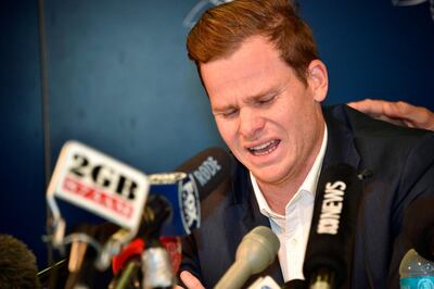 (FILES) A file photo taken on March 29, 2018 show Australian cricket player Steve Smith reacting at a press conference at the airport in Sydney, after returning from South Africa. 
 Smith admitted on June 4, 2018 he cried for four days after a ball-tampering scandal in South Africa that rocked the sport, as he told children "it's okay to show emotion". - 
 / AFP / Peter PARKS
