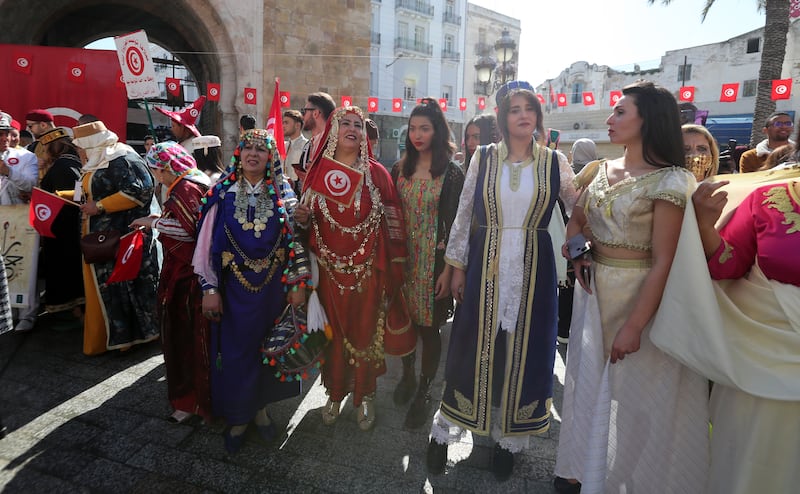 Dressed in traditional outfits, those taking part march along main Tunis thoroughfares, such as Avenue Habib Bourgiba.