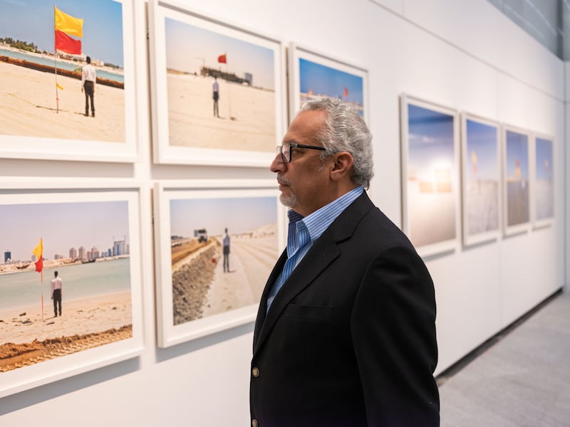 Mohammed Kazem with his photography series at the Louvre Abu Dhabi. Photo: Augustine Paredes / Seeing Things