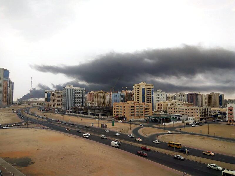 Massive cloud of smoke is spreading over Dubai almost like dark rain clouds. Photo : Aman Motwani for The National