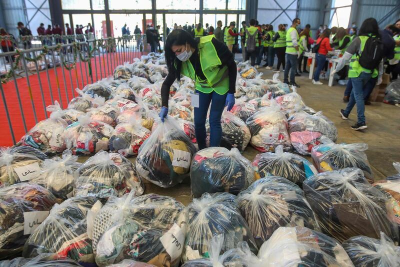 Volunteers with Dafa Campaign collect and distribute donations for those in need at Forum de Beyrouth in the Lebanese capital Beirut. The United Nations estimates that more than half of Lebanon's population is living in poverty. AFP