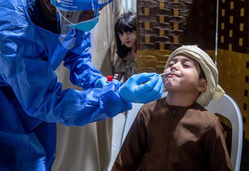 Sultan Al Marzooqi, five, gets his back to school PCR test.