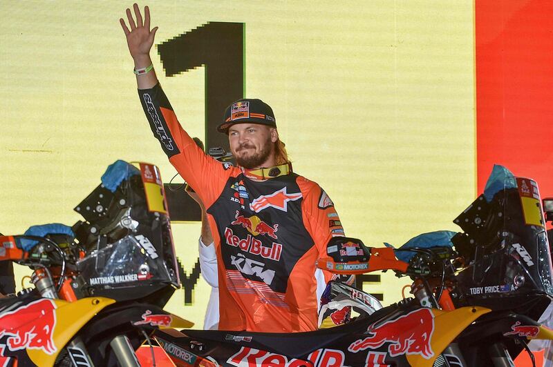Red Bull KTM's Australian rider Toby Price waves during the podium ceremony in Jeddah. AFP
