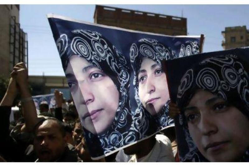 Students and activists protest against the arrest of the human-rights activist Tawakul Karaman in Sana'a yesterday.