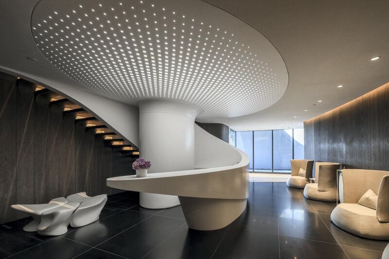 Curved structural elements, furniture and walls reflect Hadid's signature design style. 