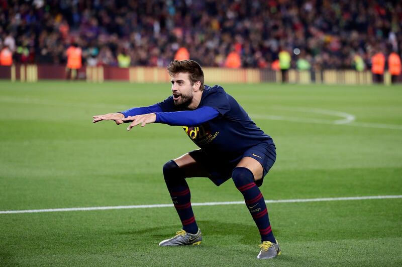 Barcelona defender Gerard Pique makes an interesting gesture in celebrating. AP Photo