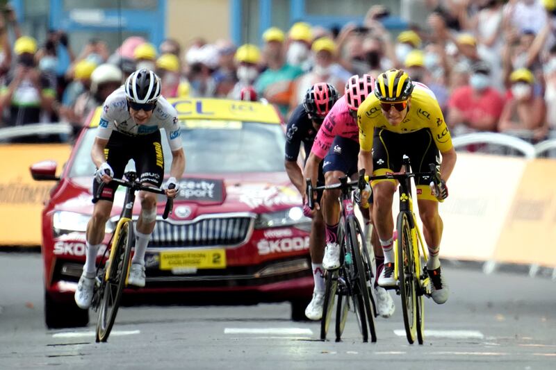 UAE Team Emirates rider  Tadej Pogacar, wearing the race leader's yellow jersey, heads to the finish line.