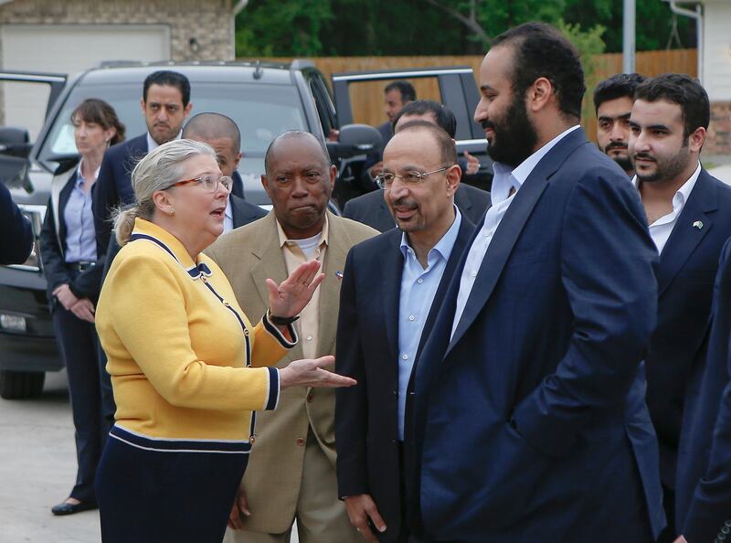 Habitat for Humanity Executive Director Allison Hay speaks to Saudi Crown Prince Mohammed bin Salman, as Houston Mayor Sylvester Turner stands by, near a Habitat for Humanity home in Houston. Steve Gonzales / AP Photo