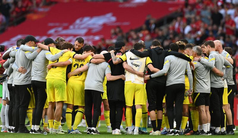 Chelsea's players gather prior to the penalty shootout. AFP