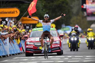 France's Nans Peters celebrates as he crosses the finish line to win the eighth stage of the Tour de France cycling race over 141 kilometers (87.6 miles) from Cazeres-sur-Garonne to Loudenvielle, France, Saturday, Sept. 5, 2020. (Stuart Franklin/Pool photo via AP)