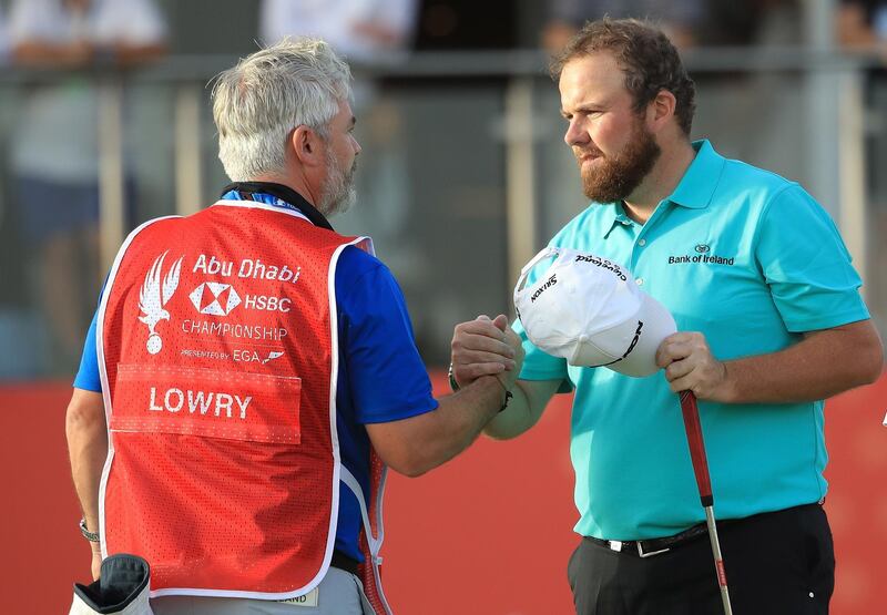 ABU DHABI, UNITED ARAB EMIRATES - JANUARY 18: Shane Lowry of Ireland shakes hands with his caddie after finishing on the 18th green during Day Three of the Abu Dhabi HSBC Golf Championship at Abu Dhabi Golf Club on January 17, 2019 in Abu Dhabi, United Arab Emirates. (Photo by Andrew Redington/Getty Images)